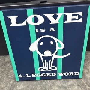Wooden sign. “Love is a 4 Legged Word”. Found thrifting.